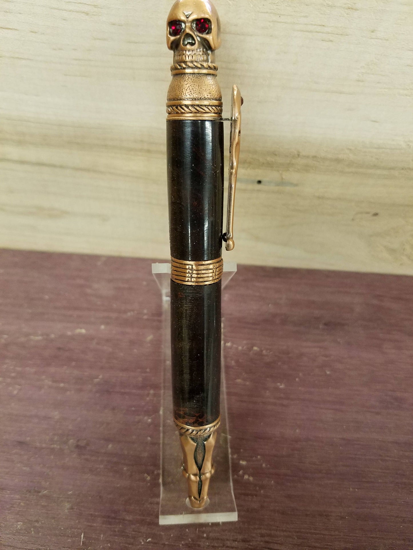 Skull pen made from double dyed black and red buckeye burl