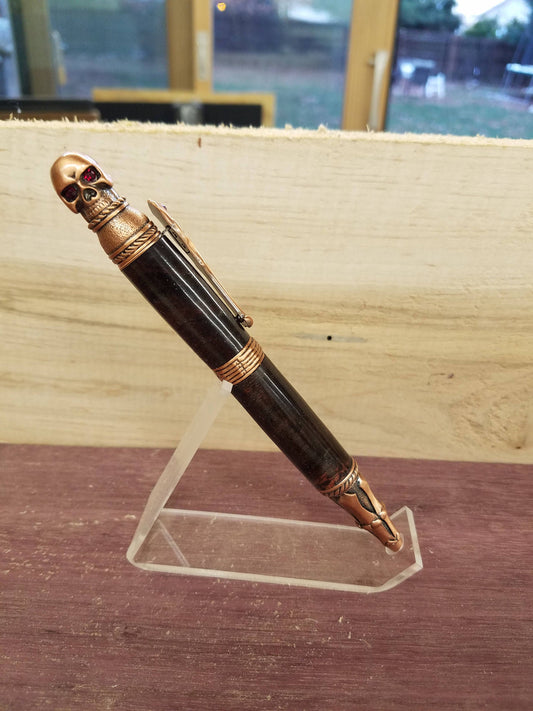 Skull pen made from double dyed black and red buckeye burl