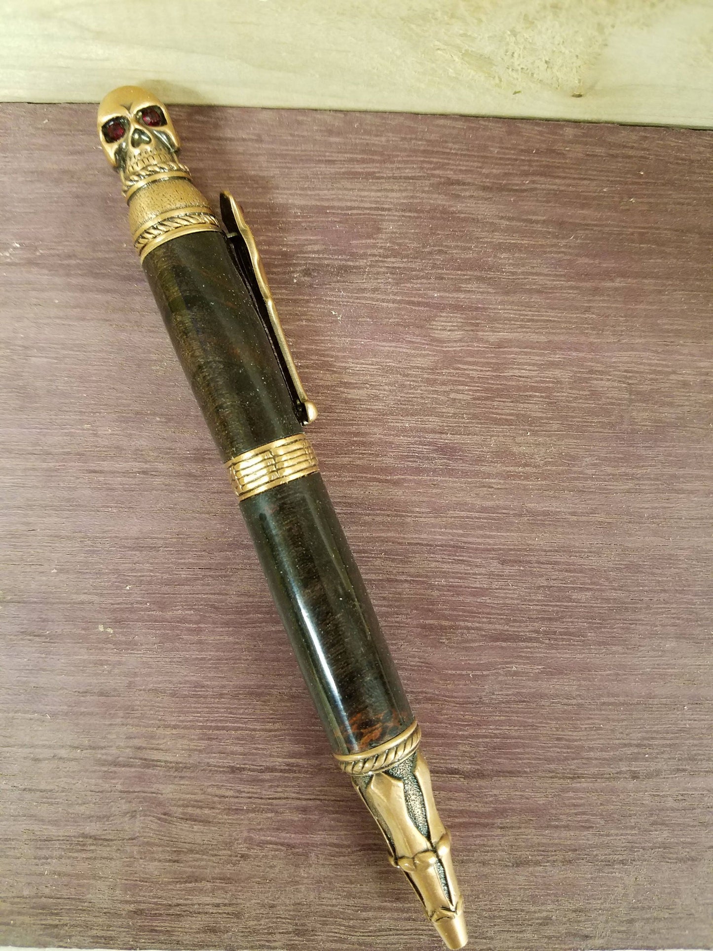 Skull pen made from double dyed black and red buckeye burl