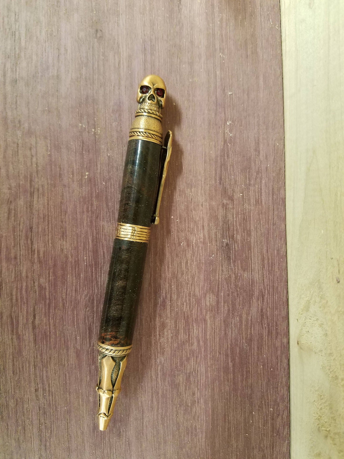 Skull pen made from double dyed black and red buckeye burl