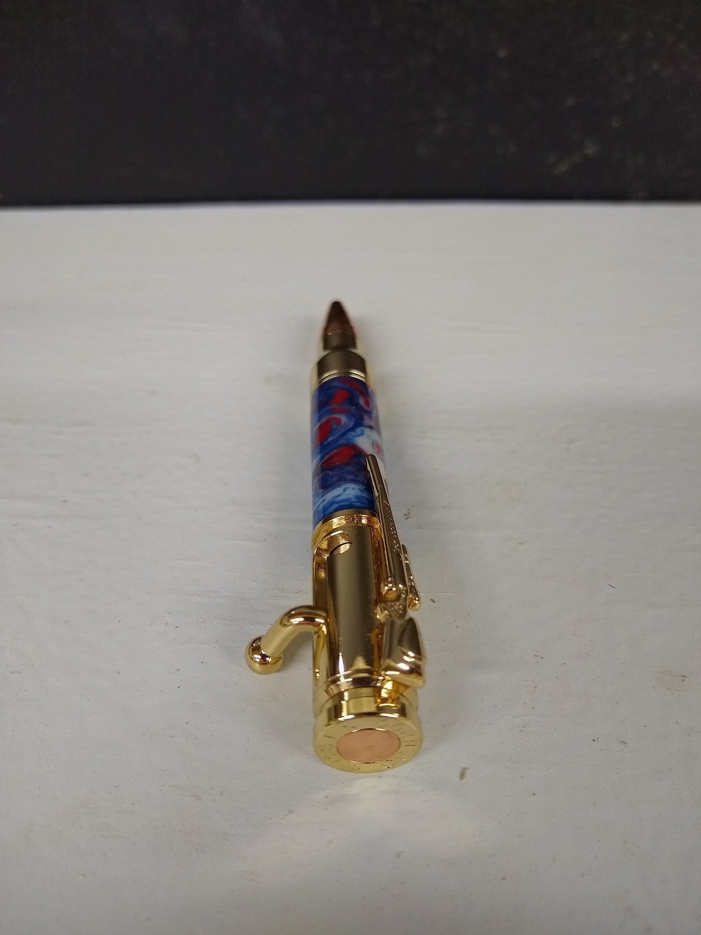 Mini 30 caliber bolt action rifle pen made from patriotic red, white and blue acrylic