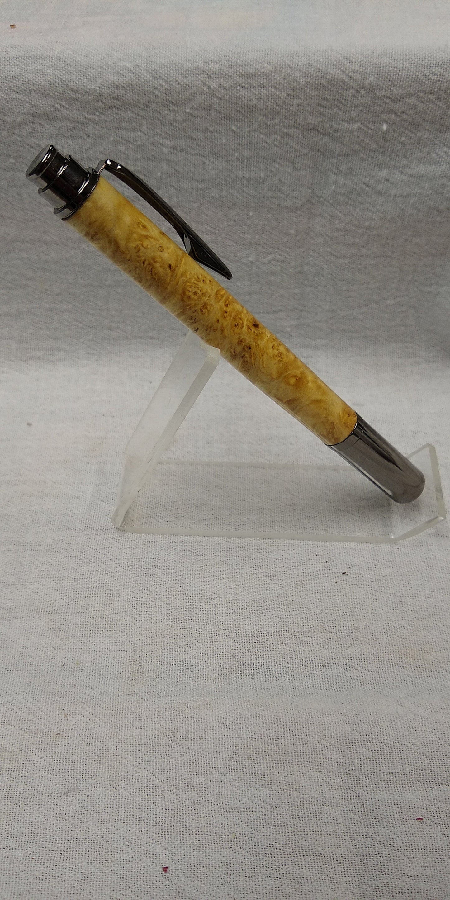 Rollster pen made from dyed bird's eye maple burl