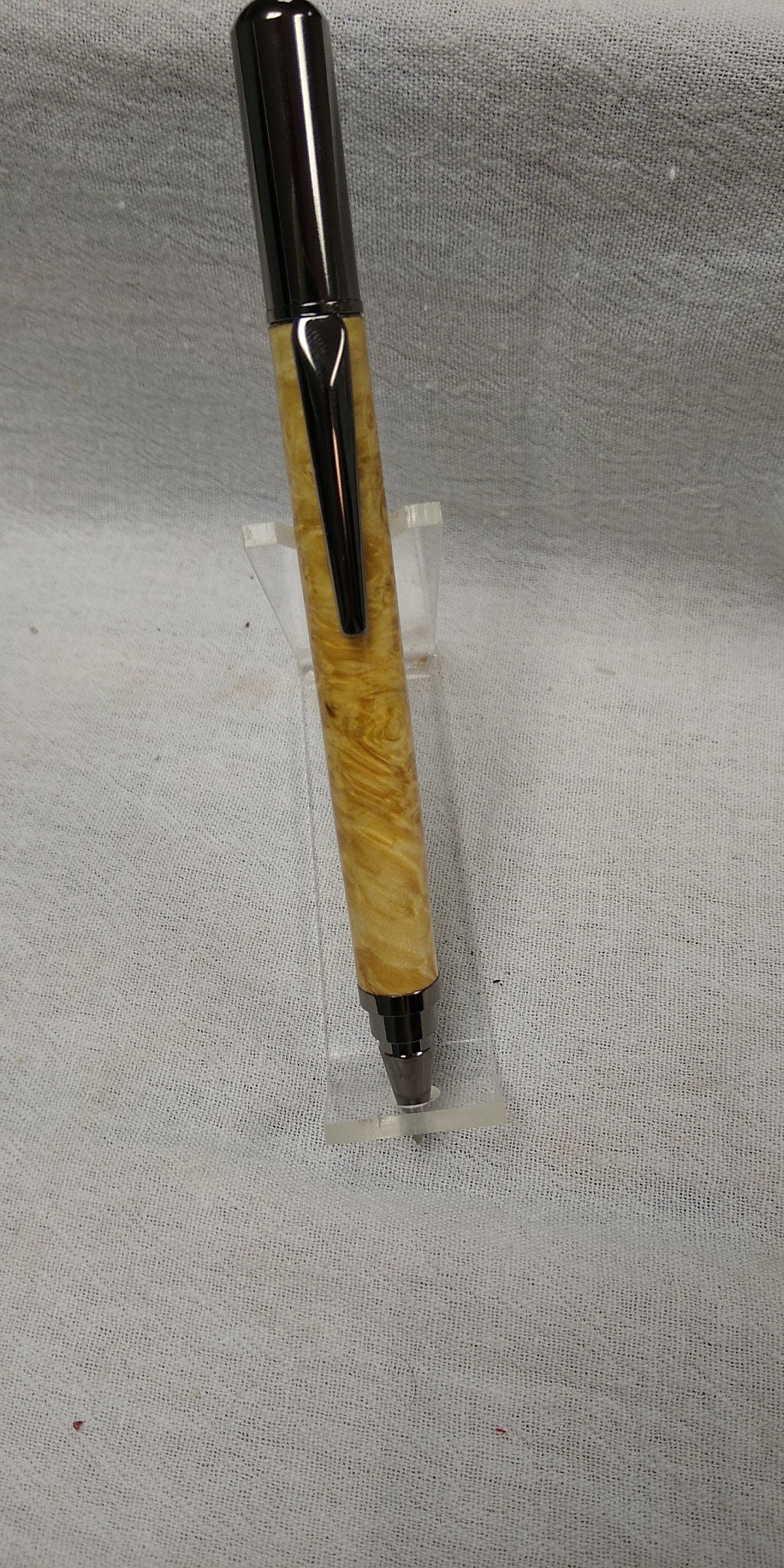 Rollster pen made from dyed bird's eye maple burl