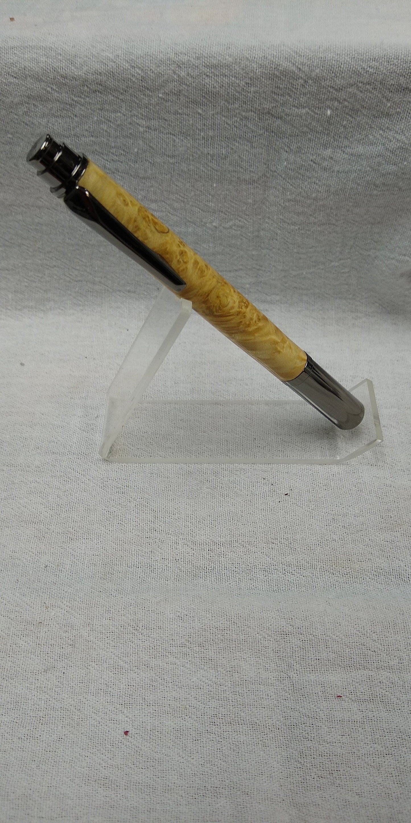 Rollster pen made from dyed bird's eye maple burl