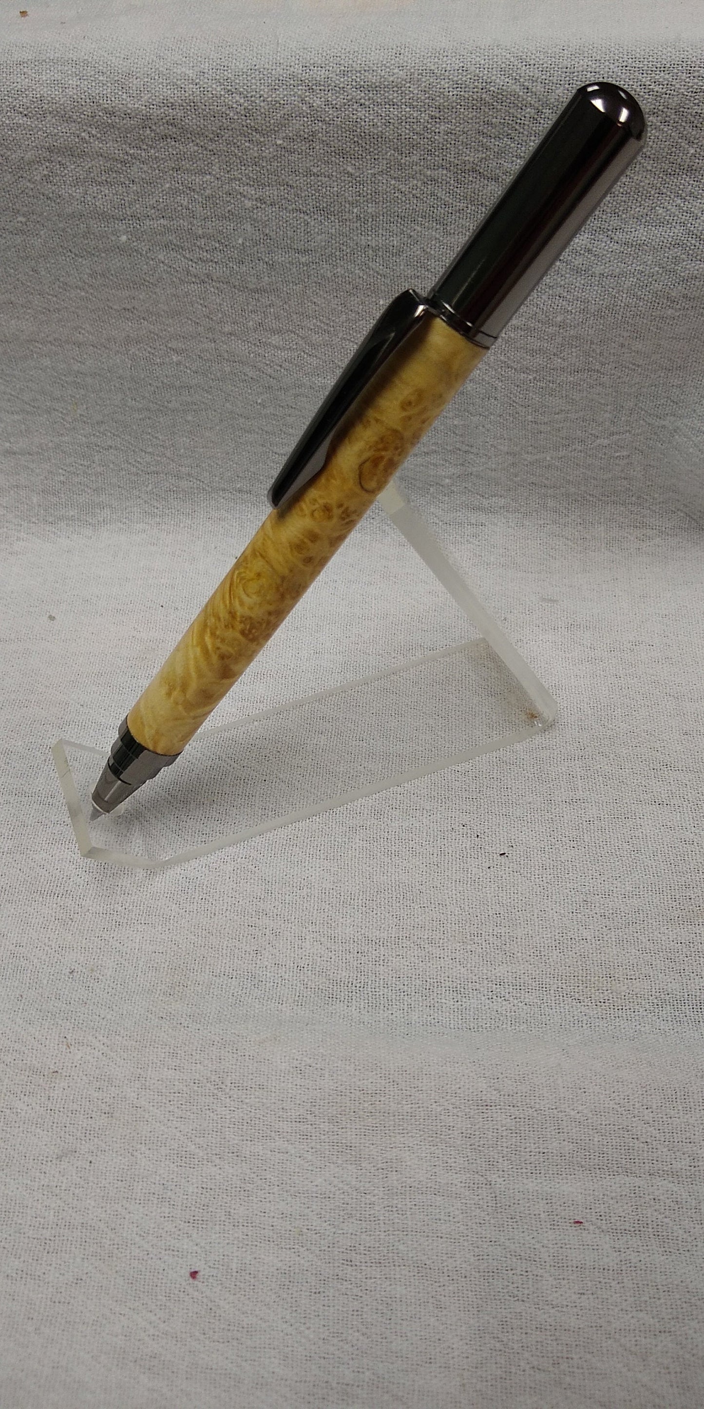 Rollster pen made from dyed bird's eye maple burl