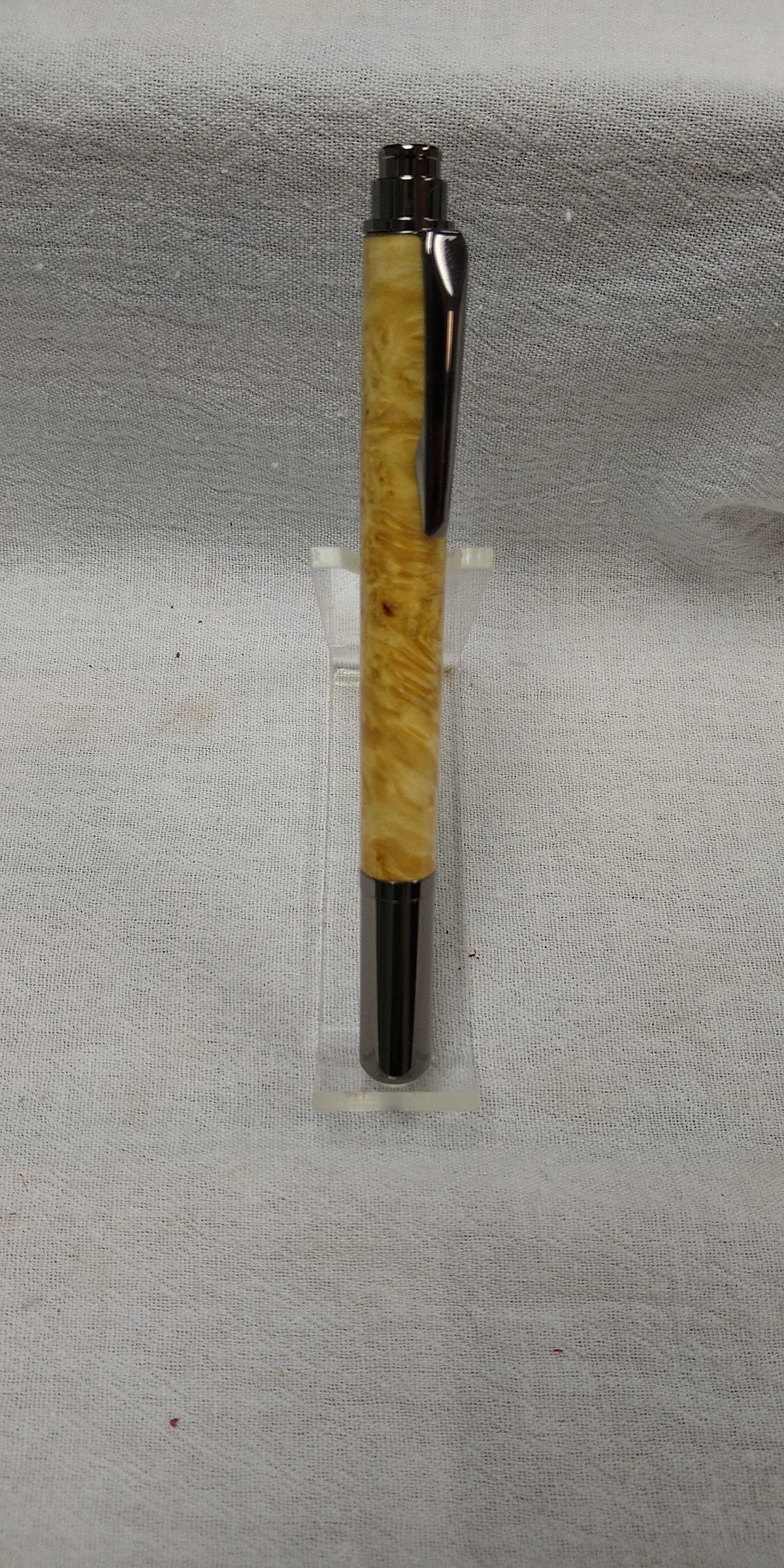 Rollster pen made from dyed bird's eye maple burl