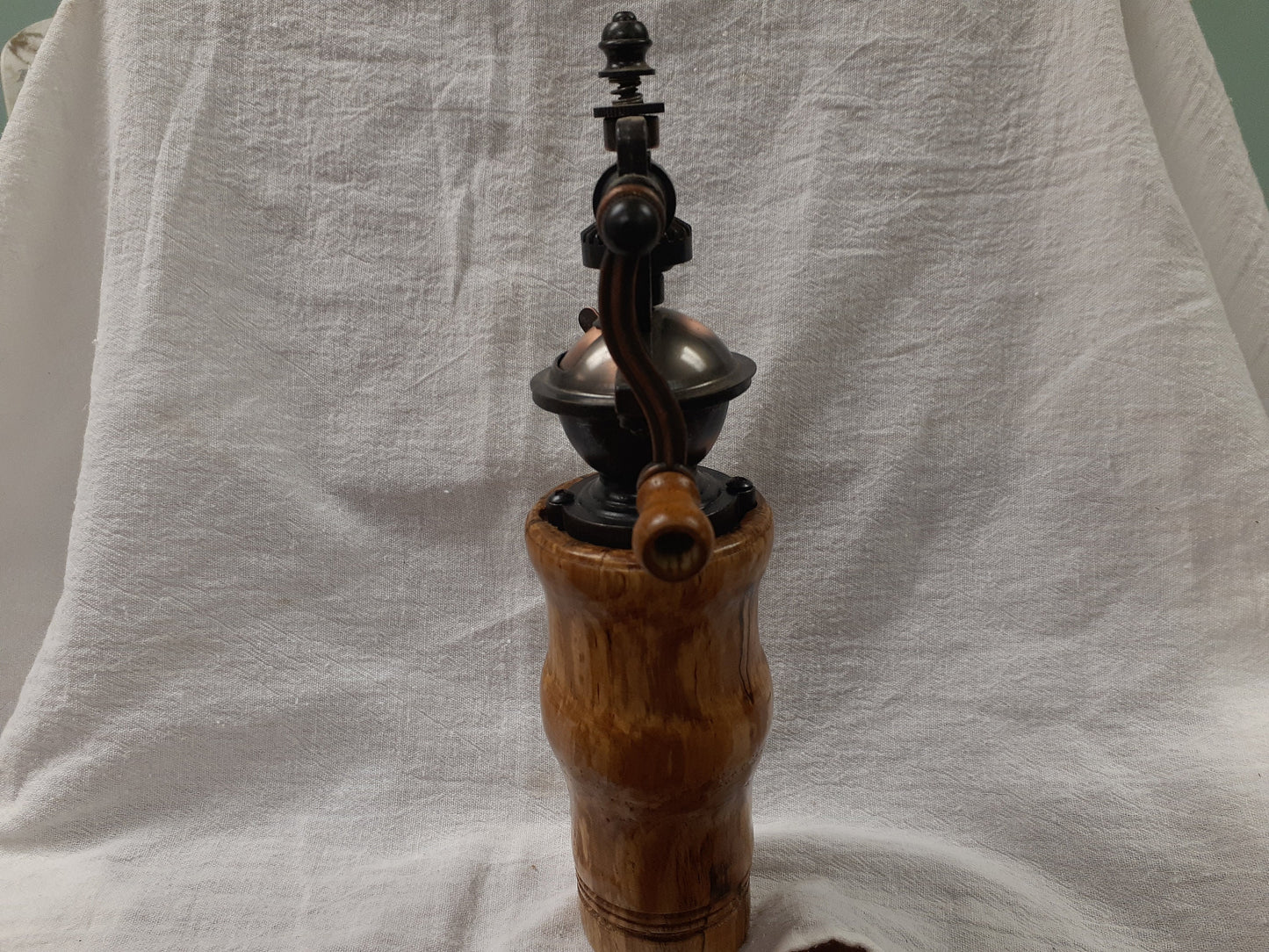 Antique style pepper grinder in antique brass and bird cherry burl