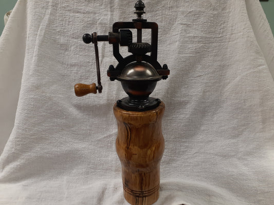 Antique style pepper grinder in antique brass and bird cherry burl