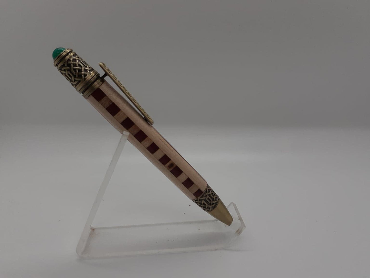 Celtic twist pen made from Padauk and Maple wood and antique copper