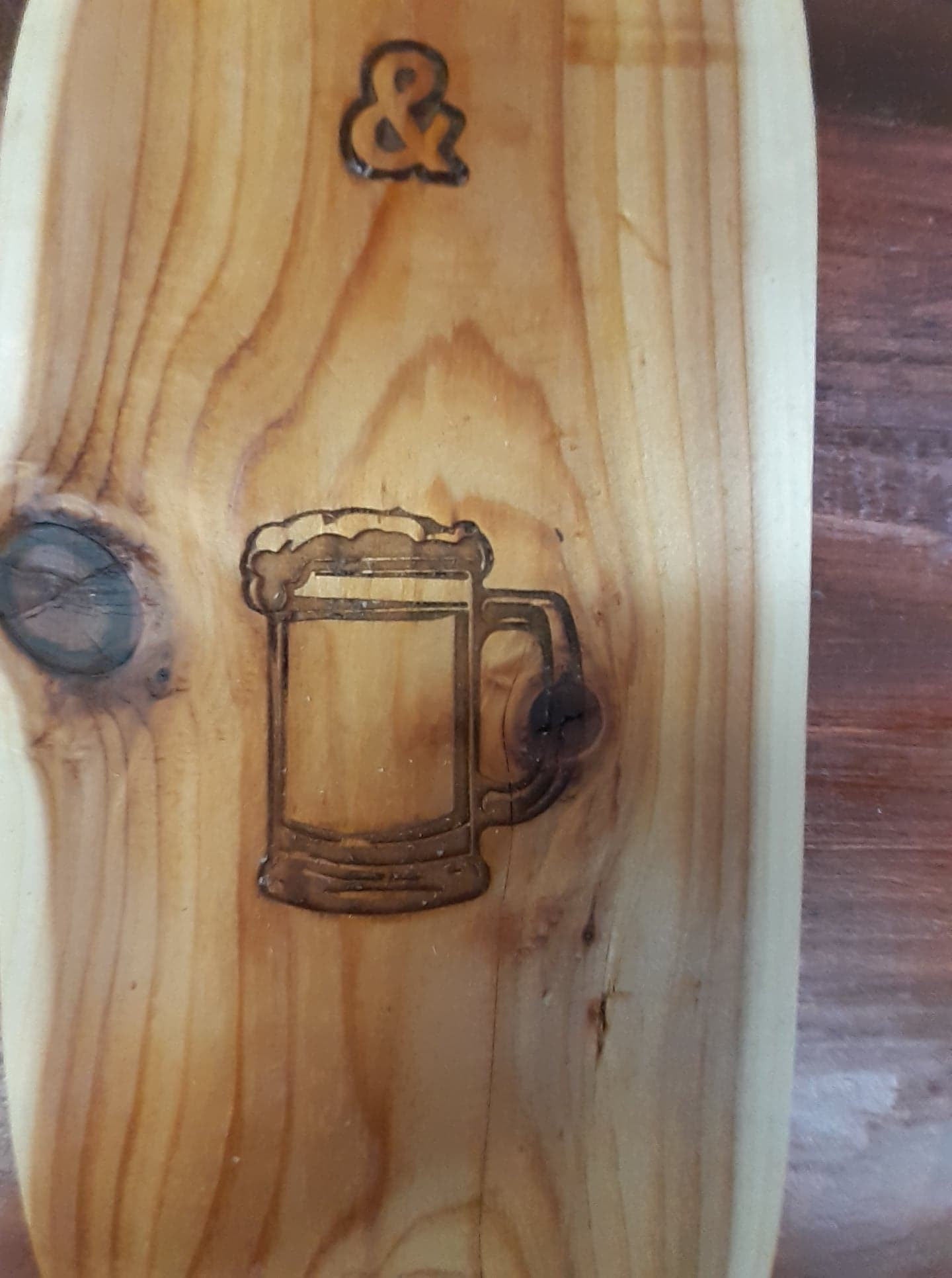 Bucks and Brews sign with bottle opener on Cedar Board