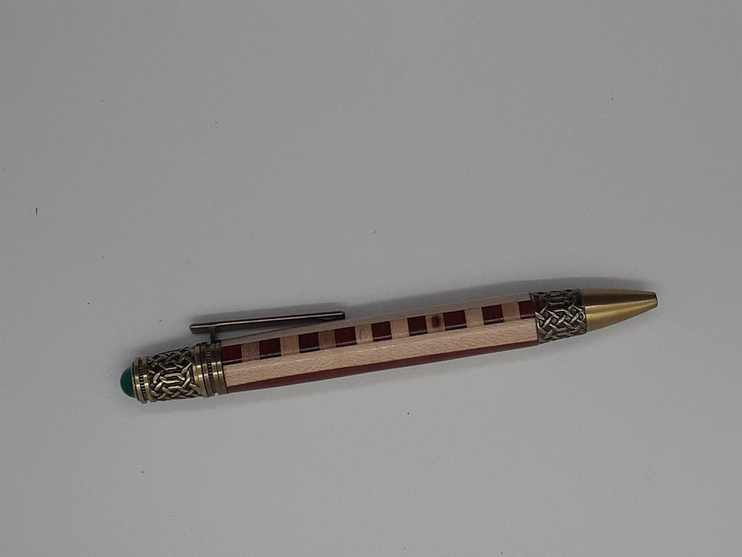 Celtic twist pen made from Padauk and Maple wood and antique copper