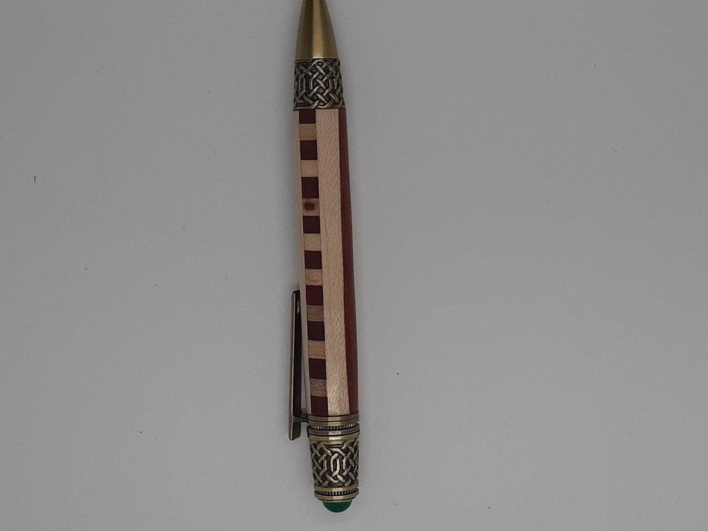 Celtic twist pen made from Padauk and Maple wood and antique copper