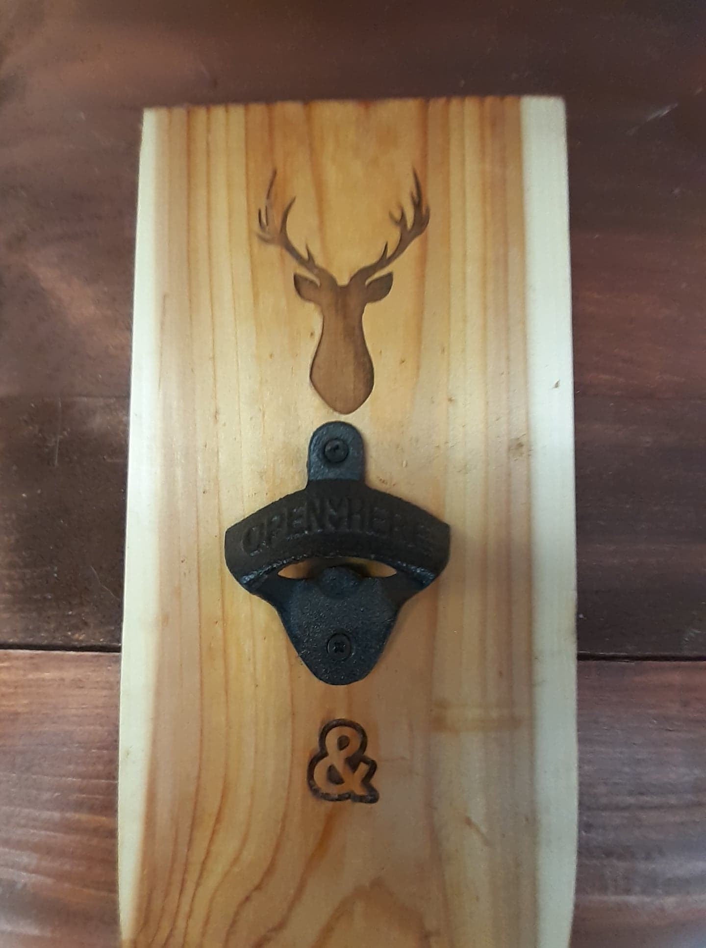 Bucks and Brews sign with bottle opener on Cedar Board