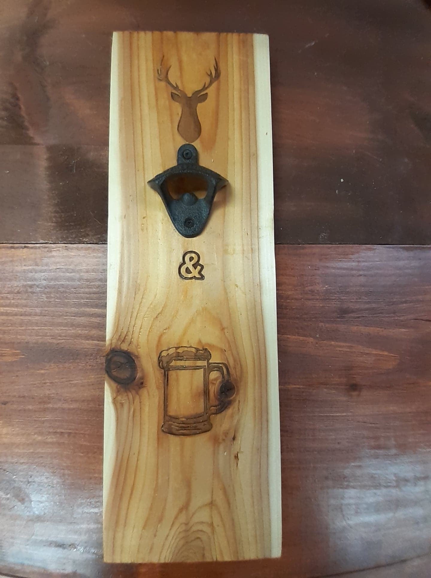 Bucks and Brews sign with bottle opener on Cedar Board