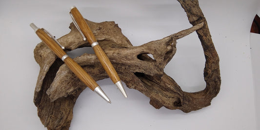 Slimline twist pen and click pencil set made from Jack Daniel's bourbon barrel stave
