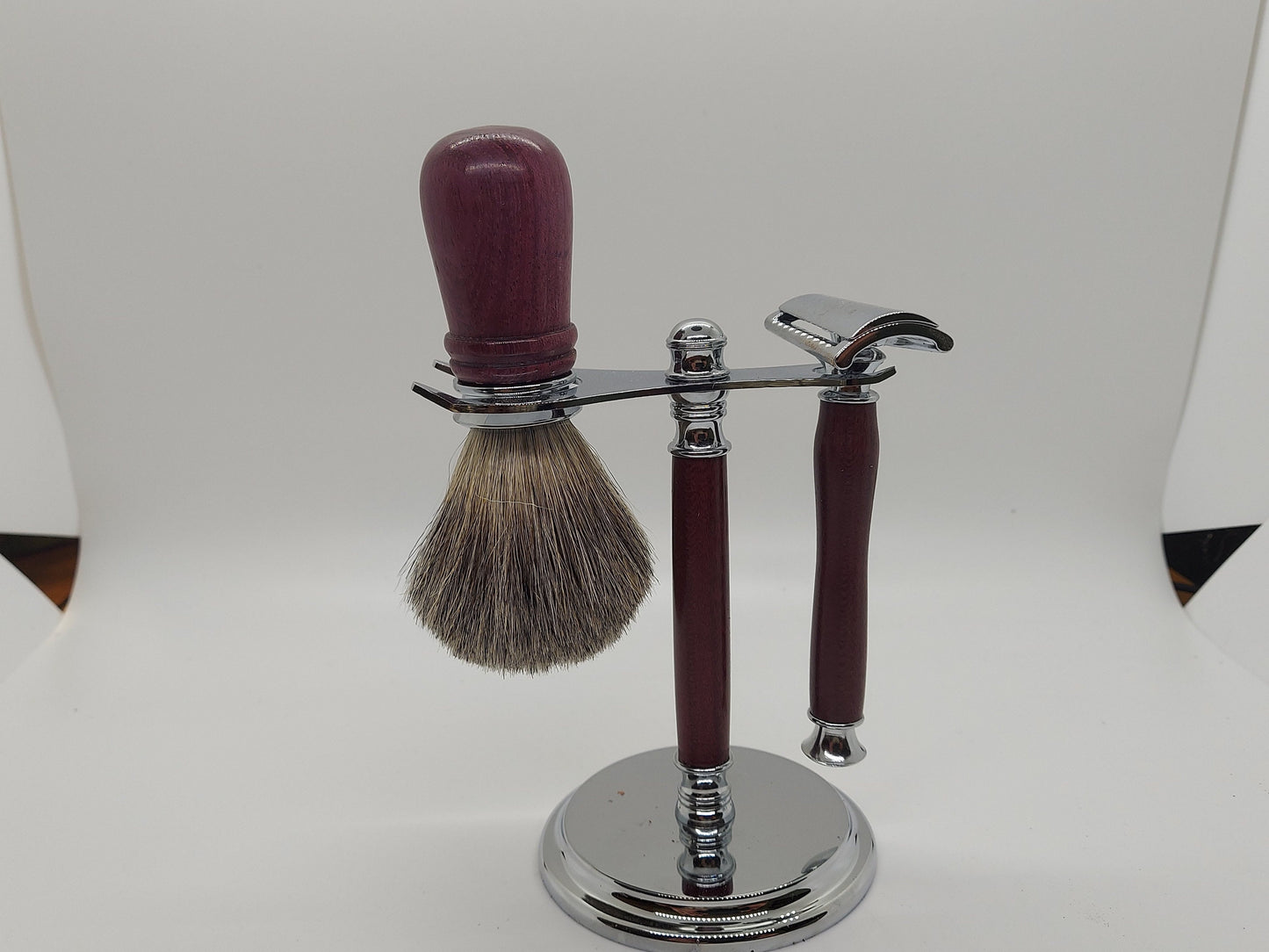 Double edged safety razor set with razor, stand and badger hair brush made from PurpleHeart Wood