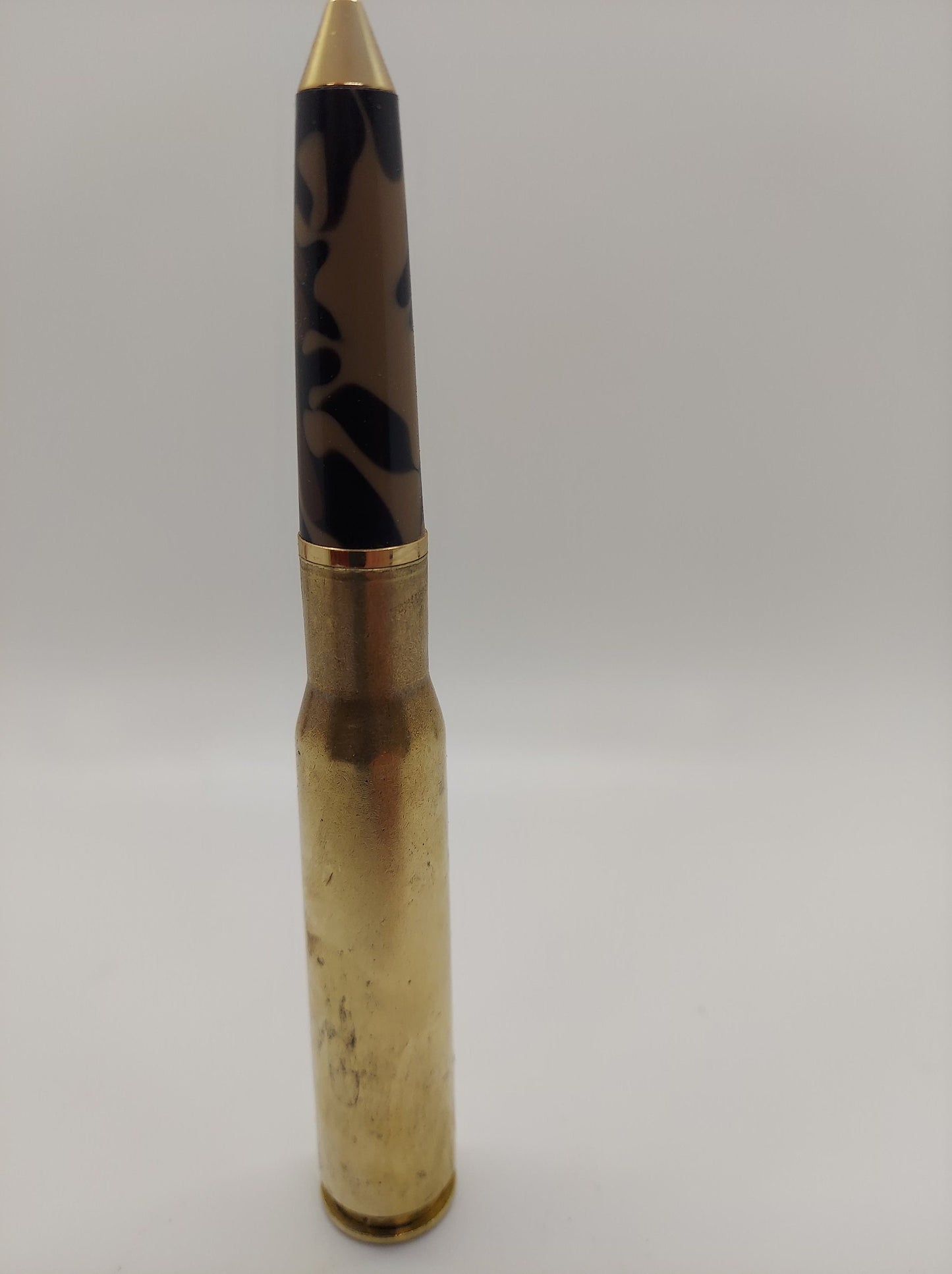 50 caliber bottle opener and twist bullet pen made from camouflaged acrylic