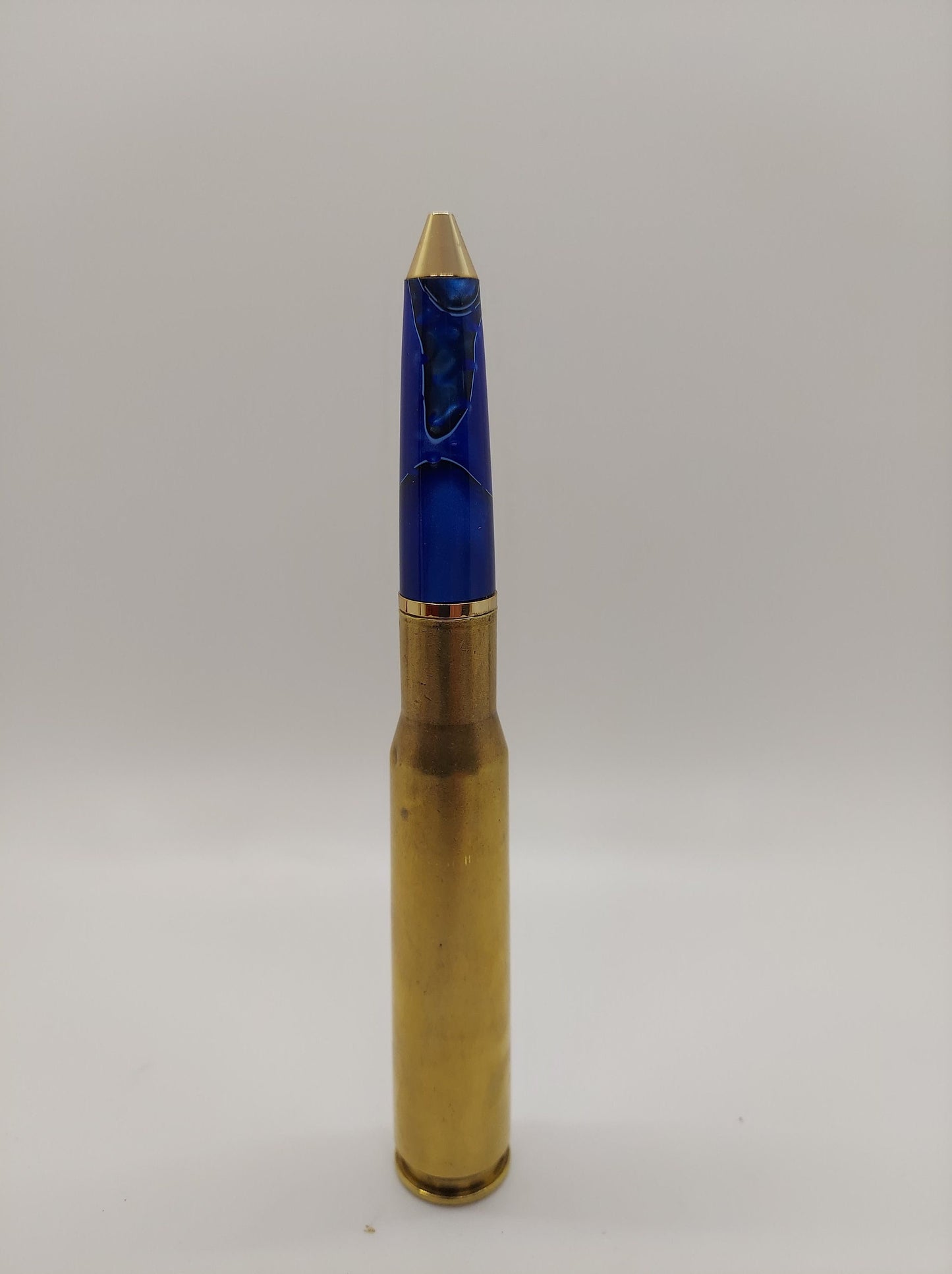 50 caliber bottle opener and twist bullet pen made from blue acrylic