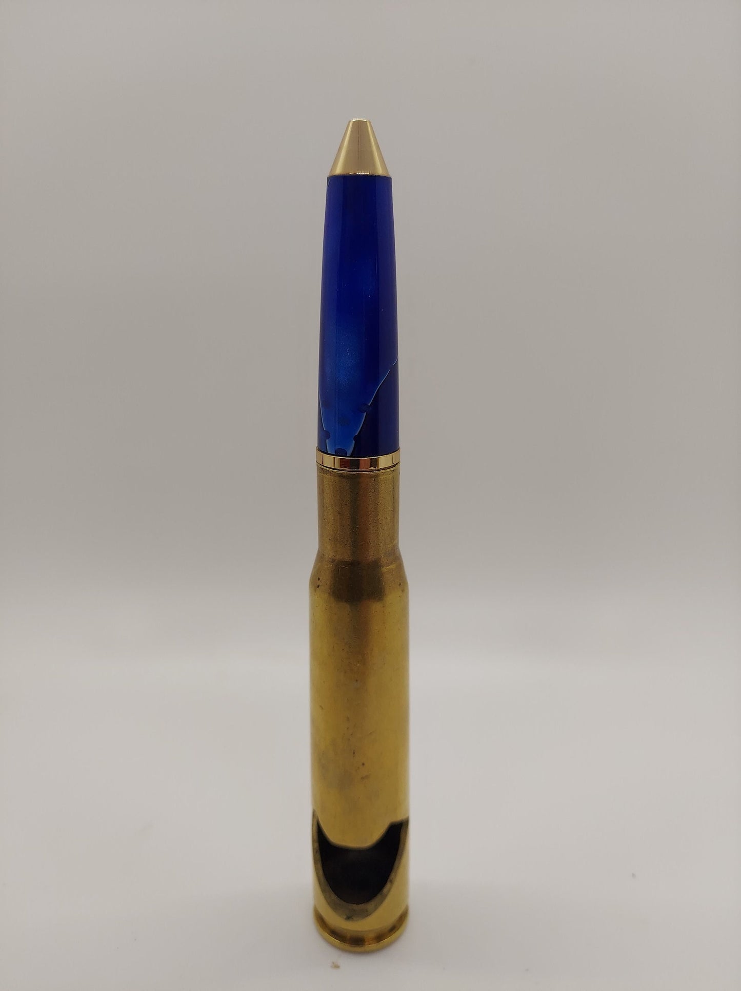 50 caliber bottle opener and twist bullet pen made from blue acrylic